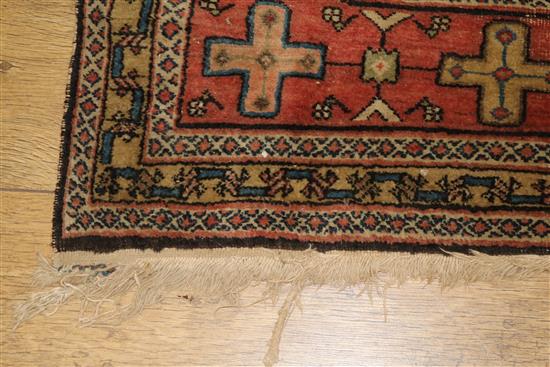 A Caucasian rug with triple medallion on a blue ground and two worn Persian rugs 210 x 120cm, 205 x 135cm and 195 x 145cm